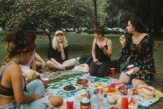 group of friends enjoying a picnic in a park