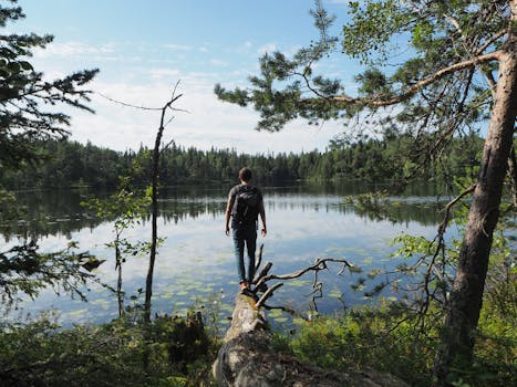 Hiker doing a push-up on a log