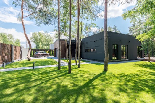 A modern eco-friendly building surrounded by greenery