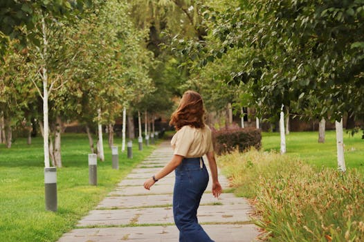 green park with trees and walking path