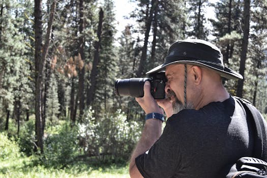 wildlife photographer with camera in nature